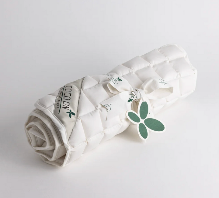 An organic quilted mattress pad to add breathability to your crib or cot mattress